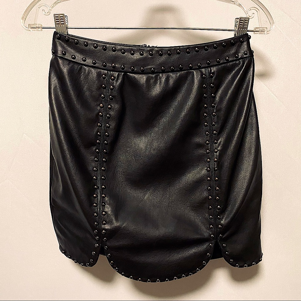Black skirt with silver stud details.